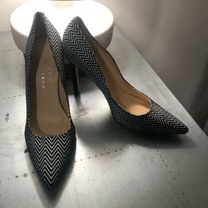 Black and white chevron pointed toe pumps